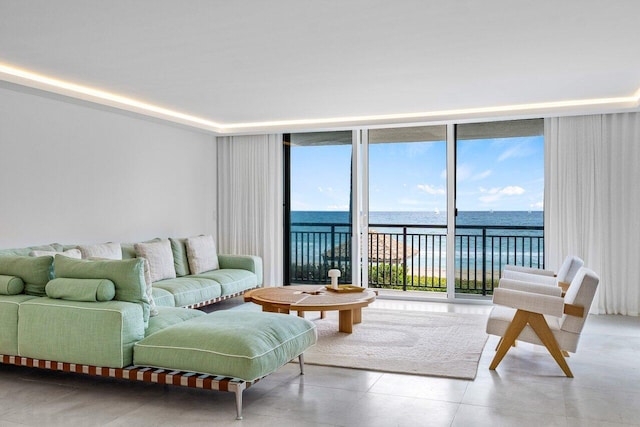 living room with a water view and floor to ceiling windows