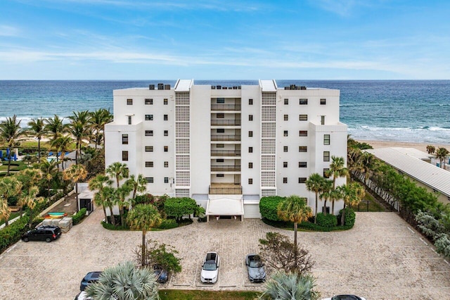 exterior space featuring a water view and a view of the beach