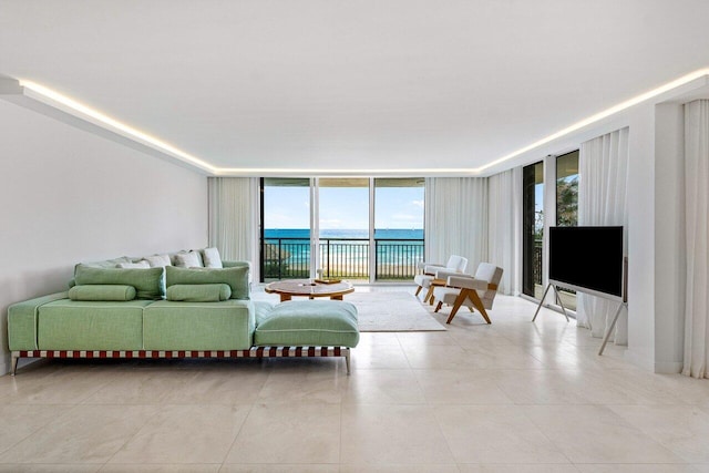 living room featuring expansive windows and light tile patterned floors