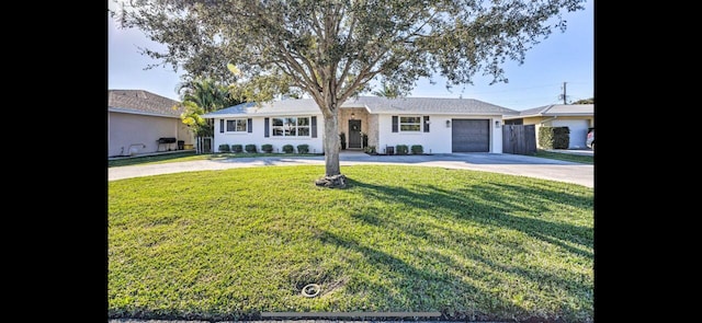 ranch-style house with a front yard and a garage