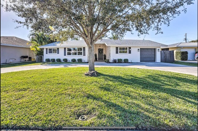 ranch-style house with a garage and a front lawn