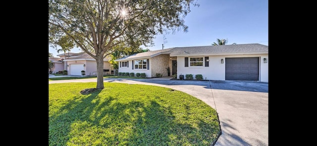 ranch-style home with a garage and a front yard