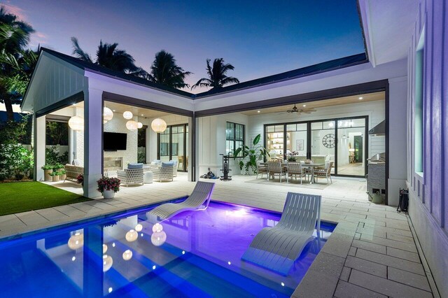 10 NW 17th St, Delray Beach, FL 33444 - living area featuring a large fireplace, wood finished floors, a chandelier, and recessed lighting