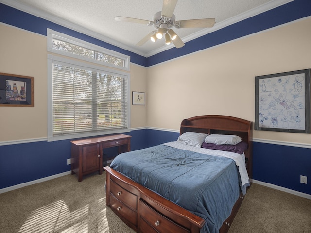 bedroom featuring ceiling fan, carpet, crown molding, and a textured ceiling