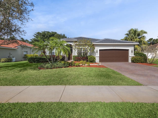 view of front facade with a garage and a front yard