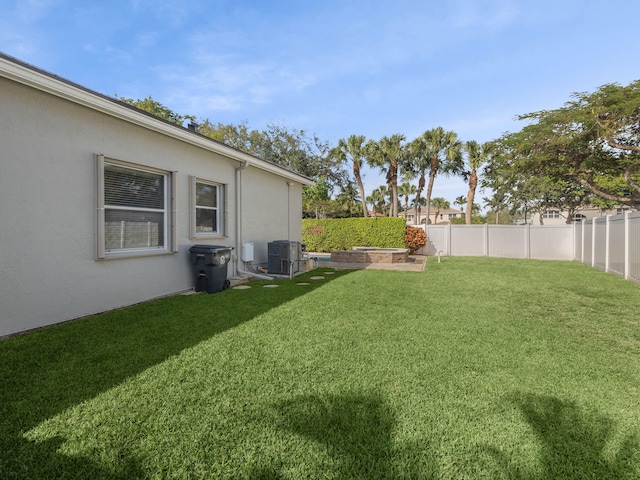 view of yard featuring central AC