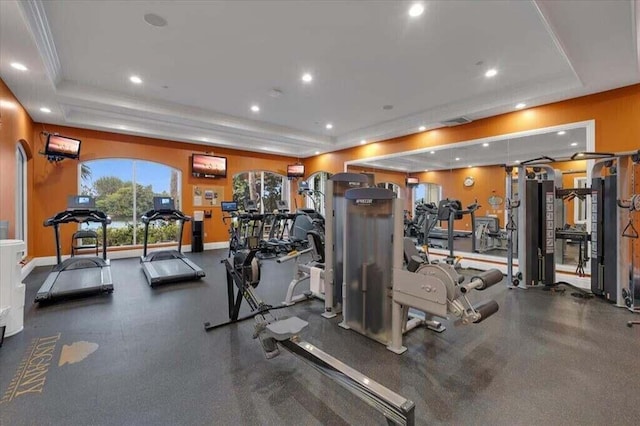 exercise room featuring a tray ceiling