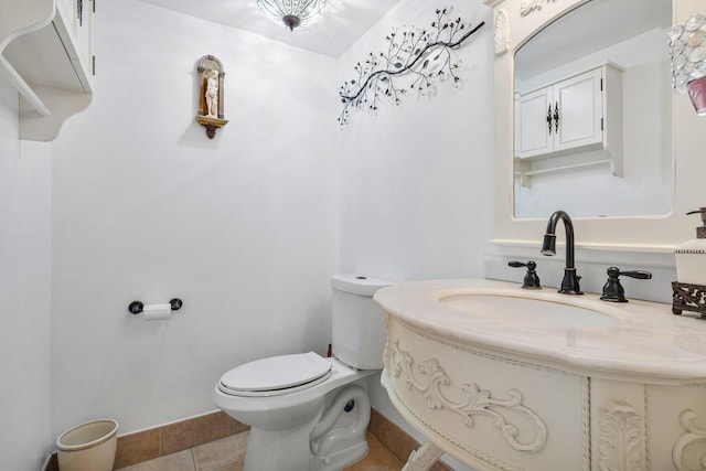 bathroom featuring sink, toilet, and tile patterned flooring