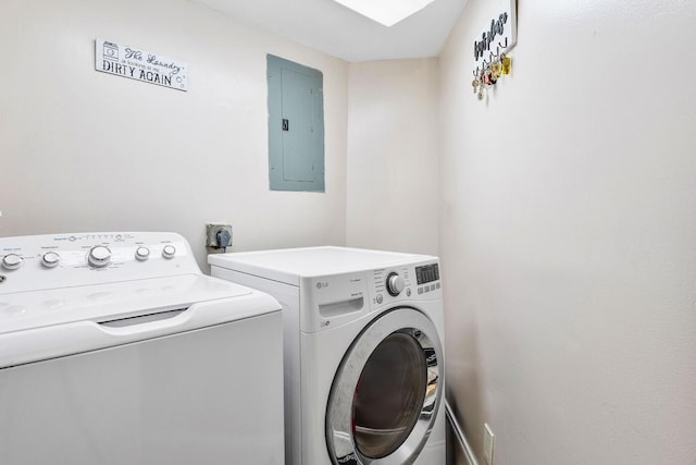 washroom with separate washer and dryer and electric panel