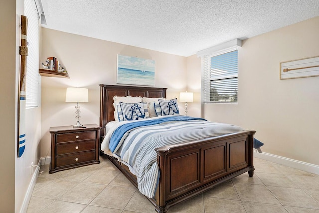 tiled bedroom with a textured ceiling