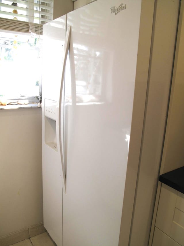 details with white refrigerator with ice dispenser