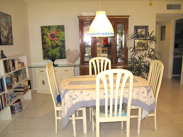 tiled dining space with electric panel