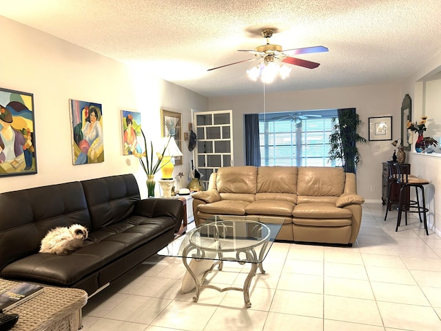 tiled living room with a textured ceiling and ceiling fan