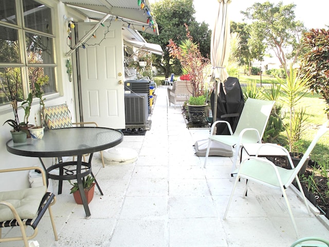 view of patio featuring central air condition unit and an outdoor living space