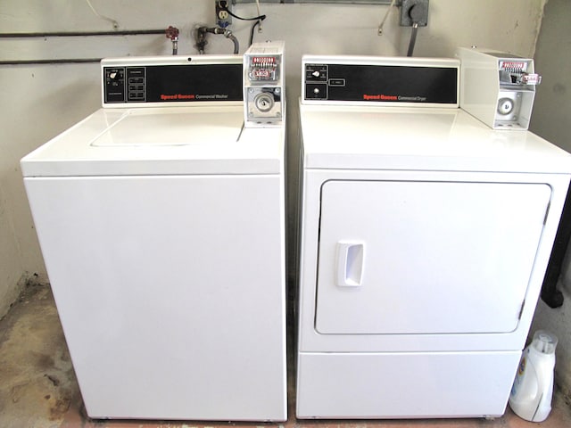 laundry area with independent washer and dryer