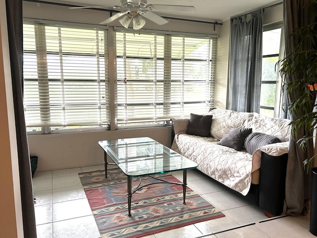 tiled living room featuring ceiling fan