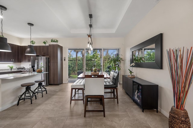 dining room featuring a tray ceiling