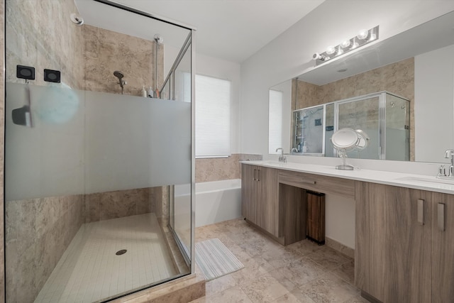 bathroom featuring independent shower and bath and vanity