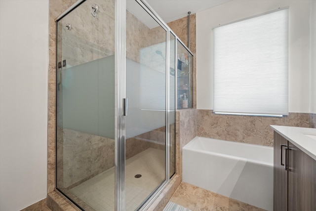 bathroom with independent shower and bath, tile patterned flooring, and vanity