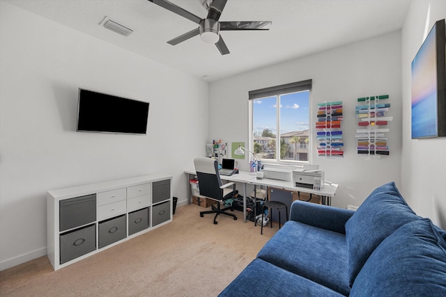 office area with ceiling fan and light carpet