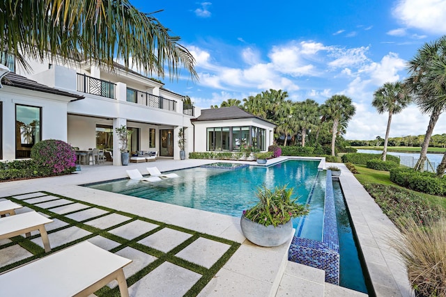 view of swimming pool featuring a patio area