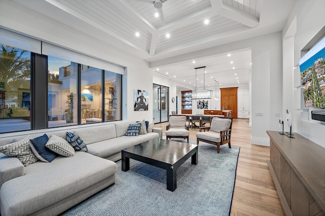 living room with wood ceiling and light hardwood / wood-style floors