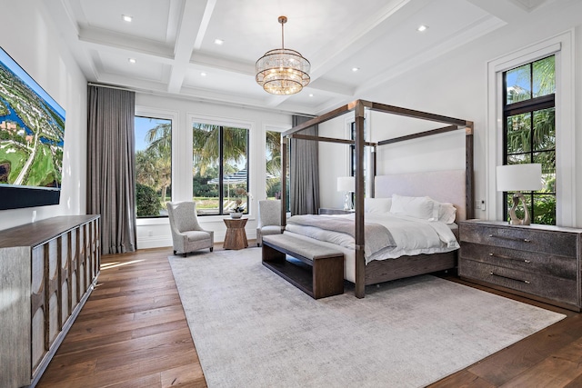 bedroom with beamed ceiling, wood-type flooring, coffered ceiling, and a chandelier