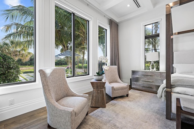 living area featuring dark hardwood / wood-style flooring, beam ceiling, and coffered ceiling