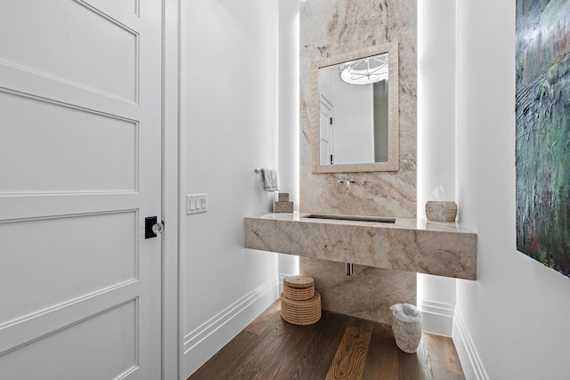 bathroom with sink and hardwood / wood-style flooring