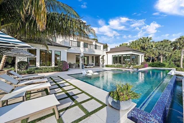 view of pool featuring a patio