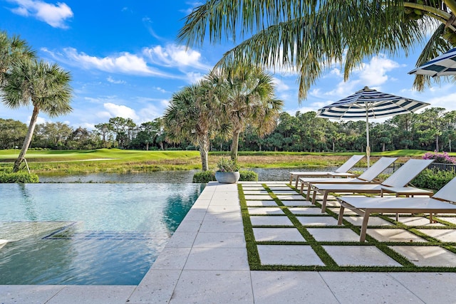 dock area featuring a water view and a patio area