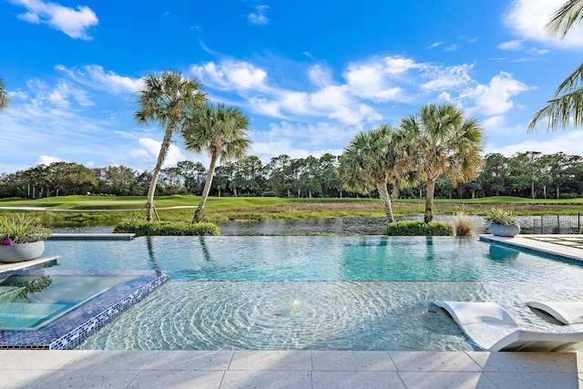 view of pool with a water view