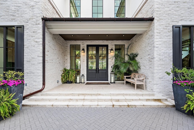 entrance to property with french doors and a patio