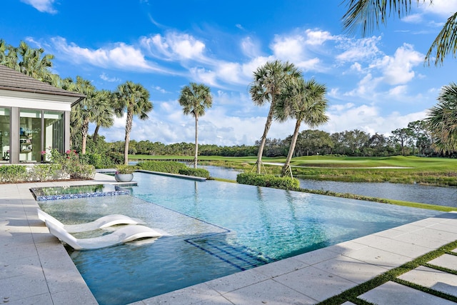 view of pool with a water view