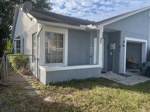 view of side of home featuring a lawn