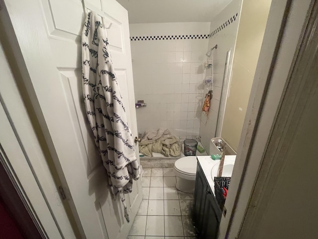 bathroom with toilet, tile patterned flooring, a shower with shower curtain, and vanity