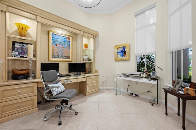 tiled office space with crown molding and a wealth of natural light