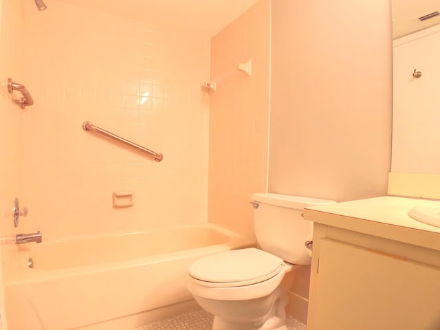 full bathroom featuring toilet, vanity, and tiled shower / bath