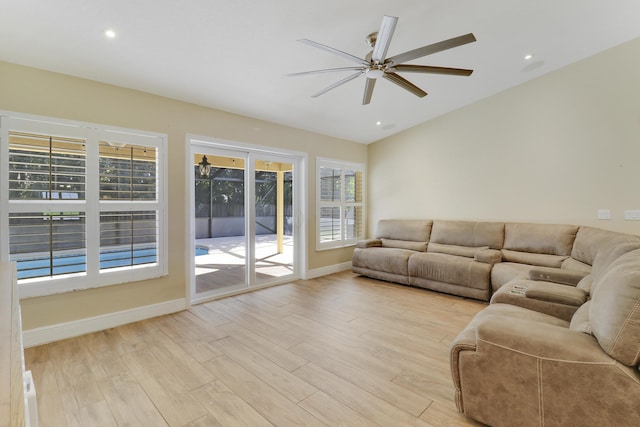 unfurnished living room with ceiling fan and light hardwood / wood-style floors