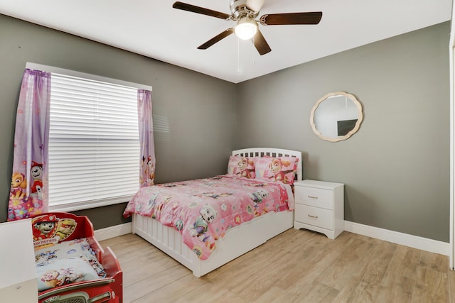 bedroom featuring ceiling fan and light hardwood / wood-style flooring