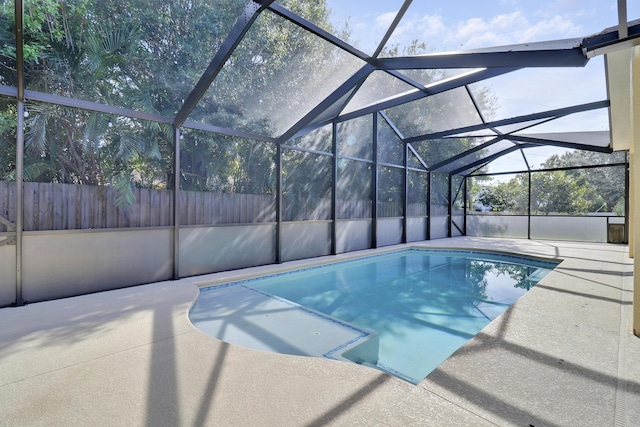 view of pool with a lanai and a patio