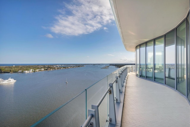 balcony featuring a water view