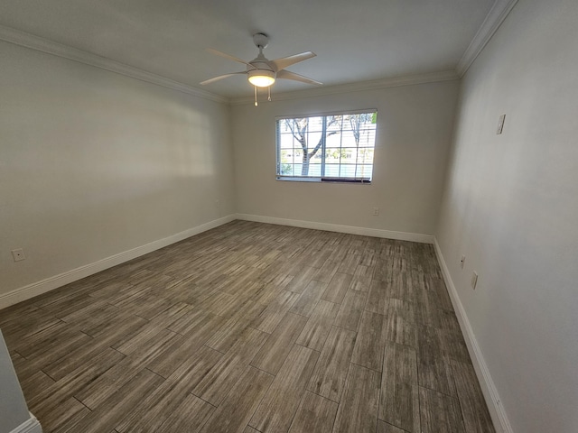 empty room with ceiling fan and ornamental molding