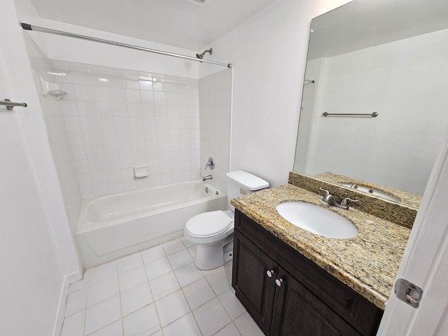 full bathroom featuring toilet, tile patterned flooring, vanity, and tiled shower / bath