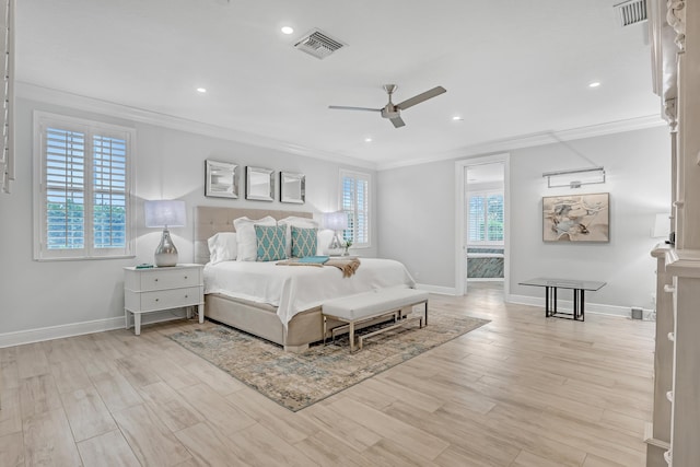 bedroom featuring light hardwood / wood-style flooring, ornamental molding, and ceiling fan