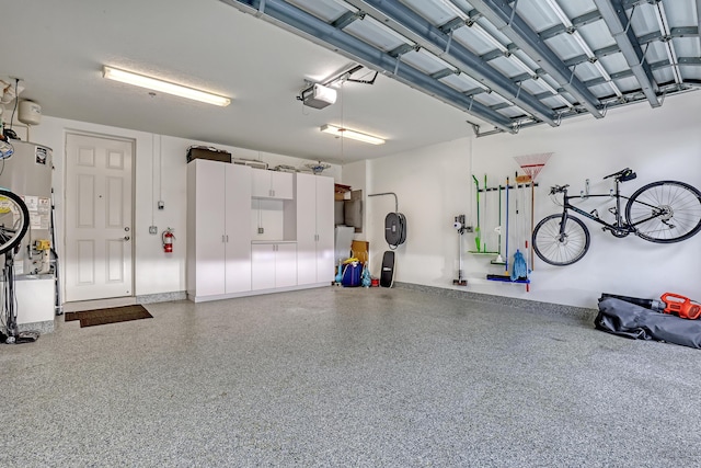 garage featuring a garage door opener and gas water heater