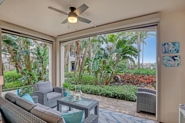 sunroom featuring plenty of natural light and ceiling fan