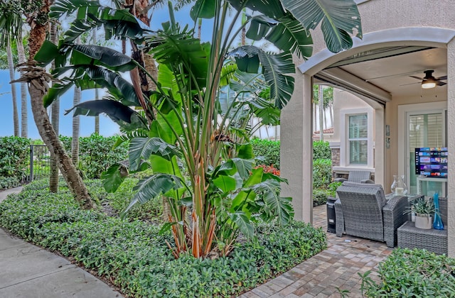 exterior space featuring ceiling fan and a patio