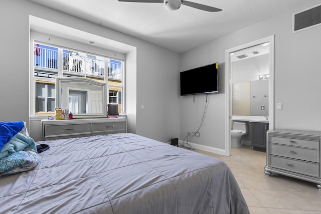 bedroom with ceiling fan, ensuite bath, and light tile patterned floors