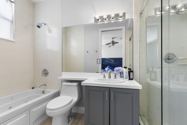 full bathroom with vanity, toilet, and tiled shower / bath combo